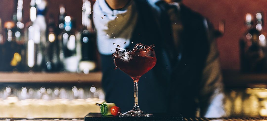 Bartender Making a Red Cocktail