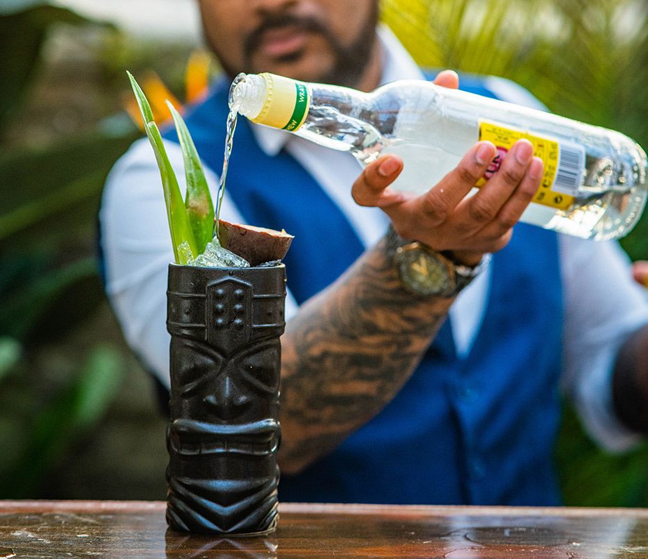 man making cocktails